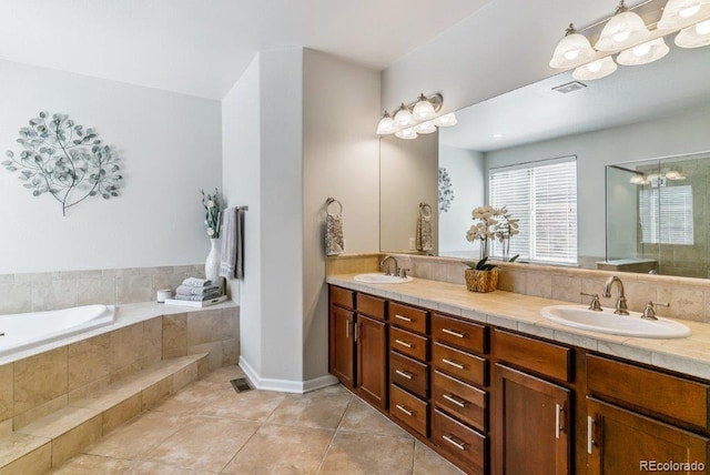 25402 E Glasgow Pl, Aurora, CO 80016 - full bathroom with double vanity, a bath, tile patterned flooring, an enclosed shower, and a chandelier