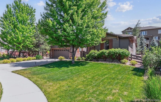 25402 E Glasgow Pl, Aurora, CO 80016 - view of front of house with driveway, a front yard, a garage, and stone siding