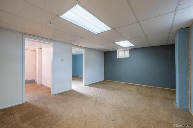 7431 Webster St, Arvada, CO 80003 - below grade area with carpet flooring, a paneled ceiling, and baseboards