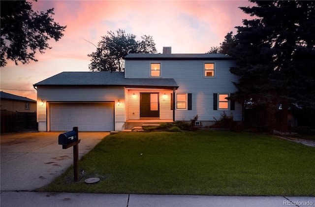 7431 Webster St, Arvada, CO 80003 - view of front of home featuring concrete driveway, a front yard, and an attached garage