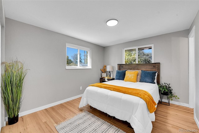 bedroom with hardwood / wood-style floors