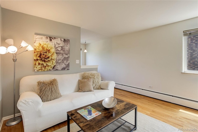 21 N Washington St Unit 301, Denver, CO 80203 - living room with wood finished floors and a baseboard heating unit