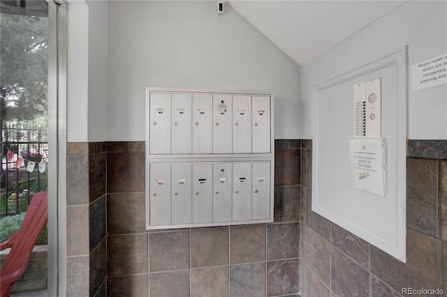 21 N Washington St Unit 301, Denver, CO 80203 - view of home's community featuring mail area, lofted ceiling, and tile walls