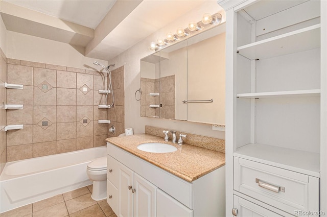 full bathroom featuring tile patterned floors, vanity, toilet, and tiled shower / bath