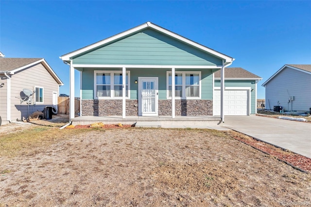 view of front of property with covered porch and a garage