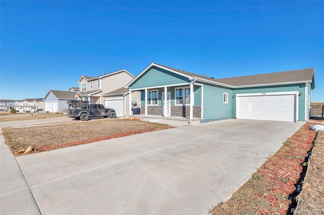 view of front of property featuring a porch and a garage