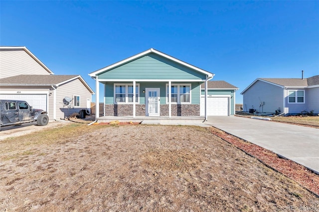 view of front of property with a porch and a garage