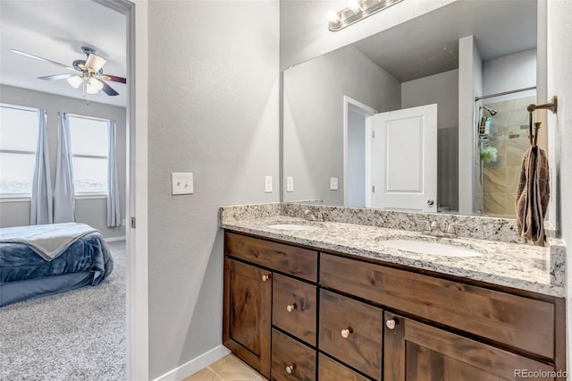 bathroom with walk in shower, vanity, and ceiling fan