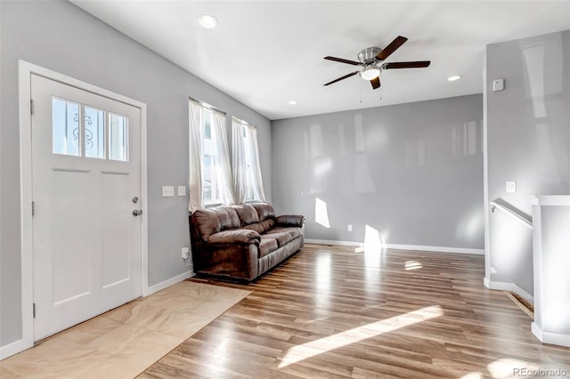 entrance foyer with ceiling fan and light wood-type flooring