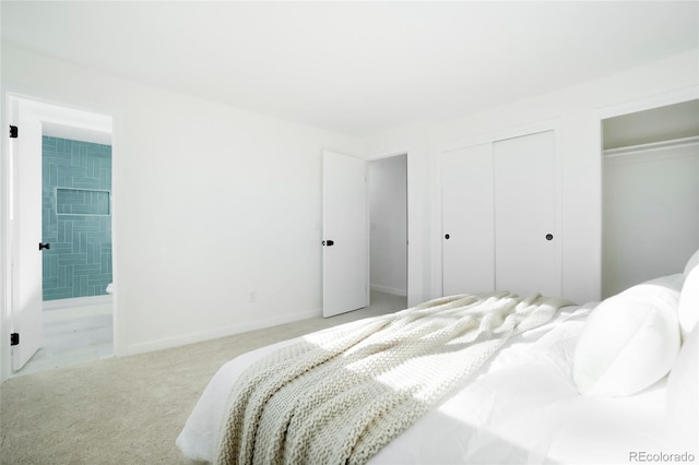 bedroom featuring carpet, connected bathroom, baseboards, and two closets