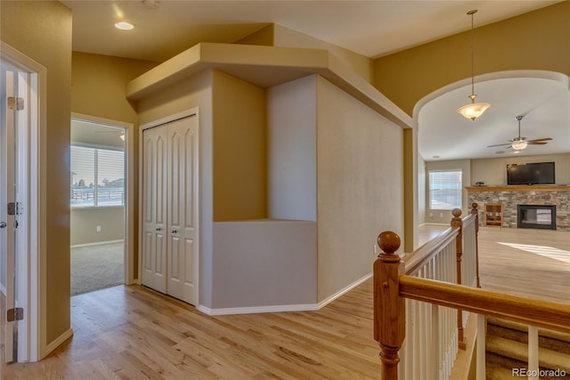 corridor with light hardwood / wood-style flooring