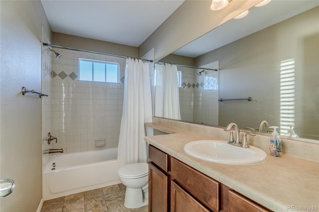 full bathroom featuring vanity, toilet, and shower / tub combo