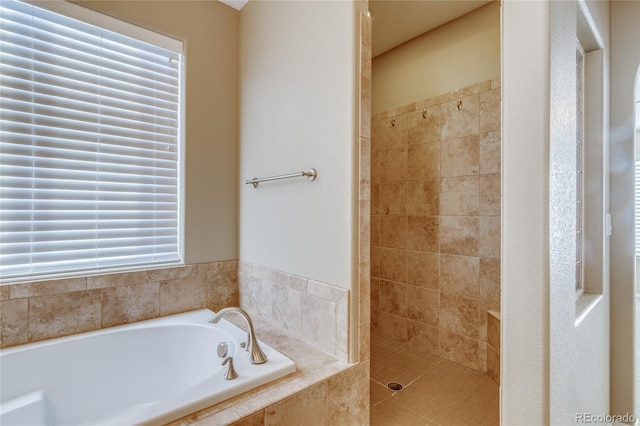 bathroom featuring plus walk in shower