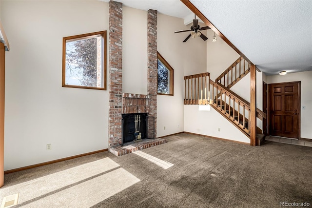 4207 S Granby Ct Unit A, Aurora, CO 80014 - unfurnished living room featuring carpet, stairs, ceiling fan, a textured ceiling, and high vaulted ceiling