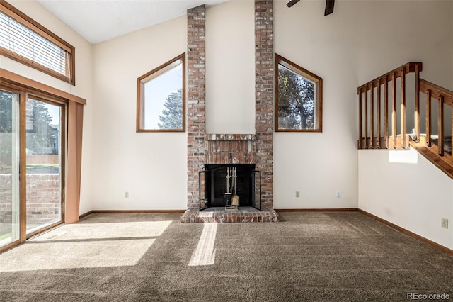 4207 S Granby Ct Unit A, Aurora, CO 80014 - unfurnished living room featuring high vaulted ceiling, healthy amount of natural light, carpet flooring, a fireplace, and ceiling fan