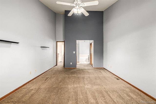 4207 S Granby Ct Unit A, Aurora, CO 80014 - unfurnished bedroom featuring a high ceiling, carpet flooring, connected bathroom, and ceiling fan