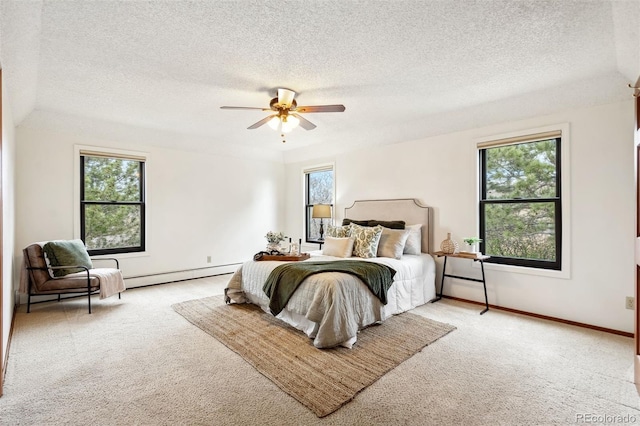 14536 Latrobe Dr, Colorado Springs, CO 80921 - carpeted bedroom featuring a textured ceiling, a baseboard heating unit, baseboards, and ceiling fan