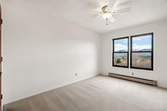 14536 Latrobe Dr, Colorado Springs, CO 80921 - spare room with a baseboard heating unit, ceiling fan, a textured ceiling, light colored carpet, and baseboards