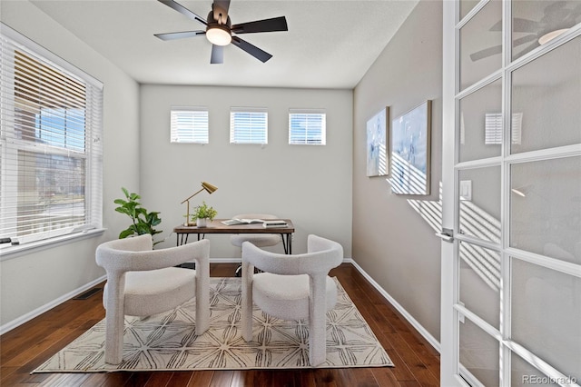 office space with ceiling fan and dark wood-type flooring