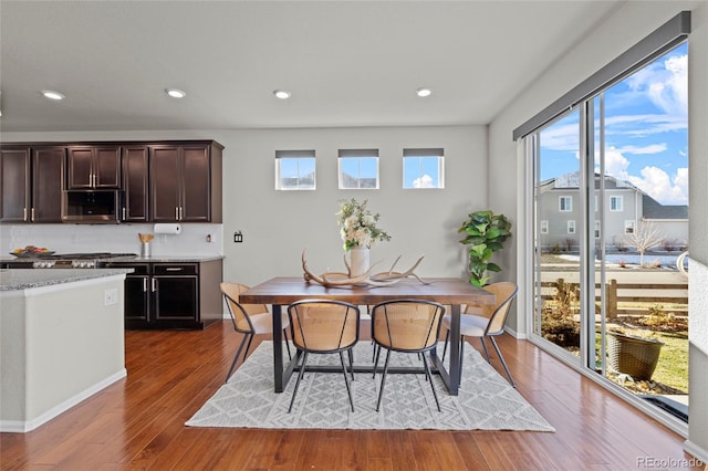 dining room with wood-type flooring