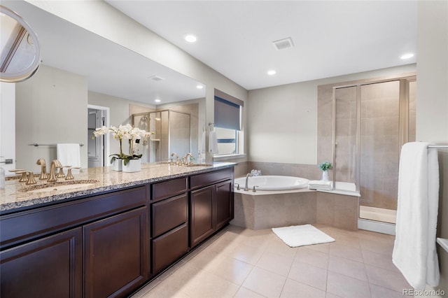 bathroom featuring tile patterned floors, vanity, and independent shower and bath