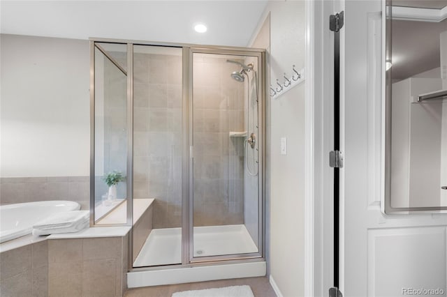 bathroom with shower with separate bathtub