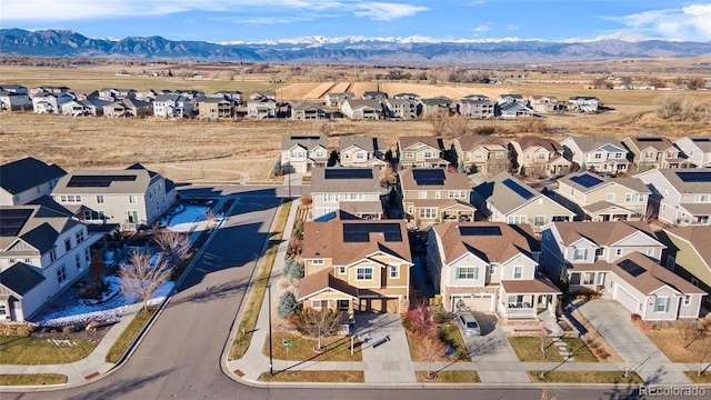 birds eye view of property with a mountain view