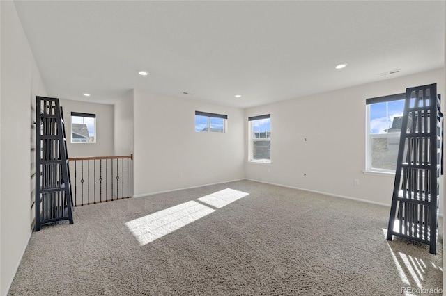 carpeted empty room featuring a healthy amount of sunlight