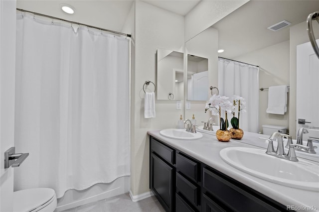 full bathroom with vanity, toilet, and shower / bathtub combination with curtain