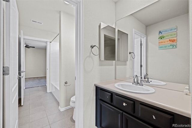 full bathroom with vanity, tile patterned flooring, ceiling fan, toilet, and tub / shower combination