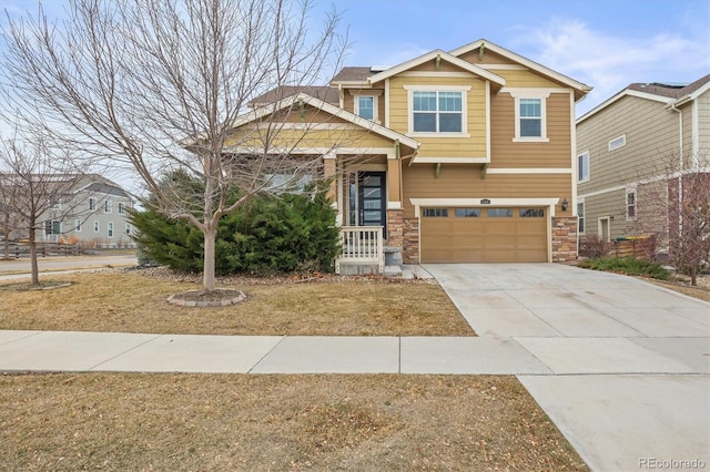 craftsman-style house with concrete driveway, a garage, and stone siding