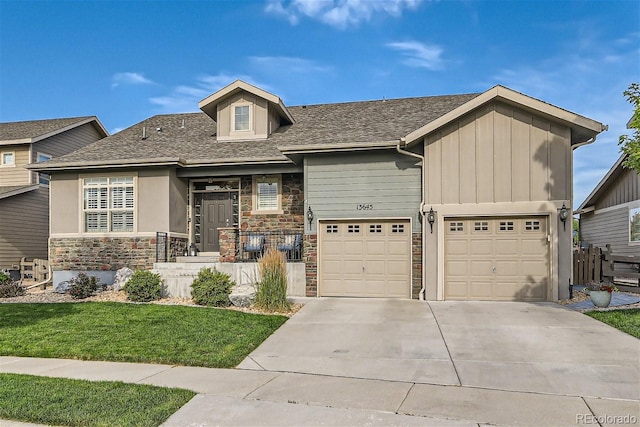 view of front facade featuring a garage, stone siding, a shingled roof, and concrete driveway