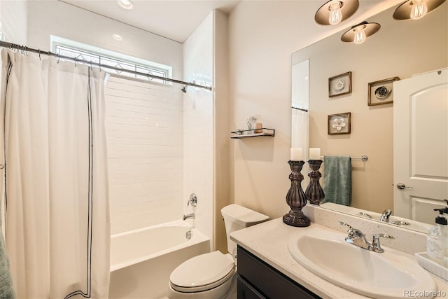 bathroom with shower / tub combo, vanity, and toilet