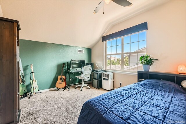 carpeted bedroom featuring baseboards, visible vents, vaulted ceiling, and a ceiling fan