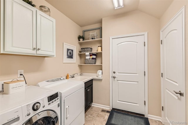 laundry area with cabinet space, baseboards, visible vents, washing machine and clothes dryer, and a sink