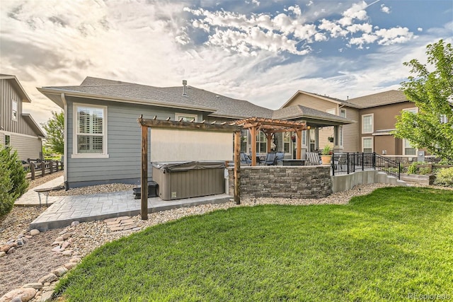 rear view of house featuring a patio area, a hot tub, a pergola, and a yard