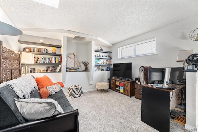 living room featuring carpet flooring, a textured ceiling, and baseboards