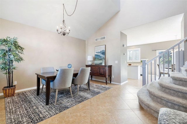 10978 Ashurst Ln, Highlands Ranch, CO 80130 - dining space with a chandelier, stairs, high vaulted ceiling, and tile patterned floors