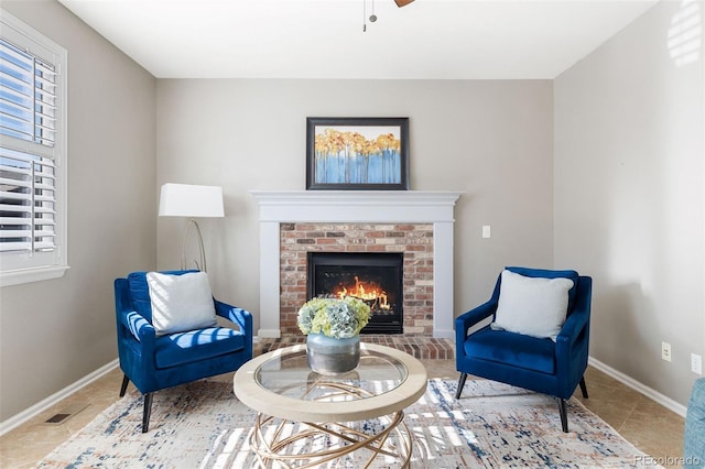 10978 Ashurst Ln, Highlands Ranch, CO 80130 - living area featuring a fireplace, tile patterned flooring, and a ceiling fan