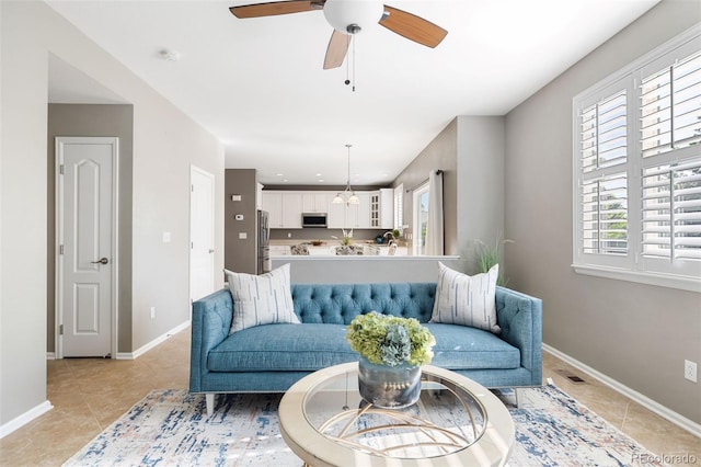 10978 Ashurst Ln, Highlands Ranch, CO 80130 - living room featuring light tile patterned floors and ceiling fan