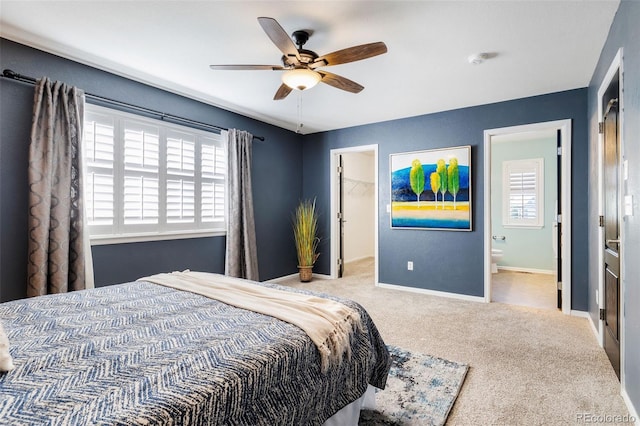 10978 Ashurst Ln, Highlands Ranch, CO 80130 - bedroom with carpet, a walk in closet, a closet, ensuite bath, and ceiling fan