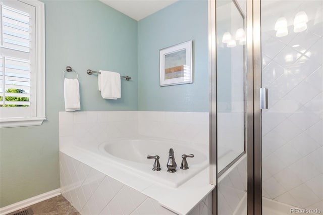 10978 Ashurst Ln, Highlands Ranch, CO 80130 - full bath featuring a garden tub and a shower stall