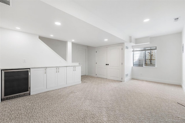 10978 Ashurst Ln, Highlands Ranch, CO 80130 - below grade area featuring recessed lighting, light colored carpet, and wine cooler