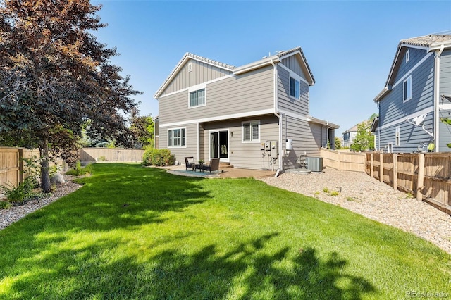 10978 Ashurst Ln, Highlands Ranch, CO 80130 - rear view of property with board and batten siding, a fenced backyard, and a patio area