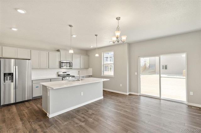 14249 Beebalm Ave, Parker, CO 80134 - kitchen with stainless steel appliances, a sink, tasteful backsplash, light countertops, and baseboards