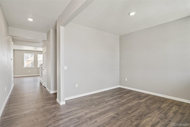 14249 Beebalm Ave, Parker, CO 80134 - spare room featuring baseboards, dark wood-style flooring, and recessed lighting
