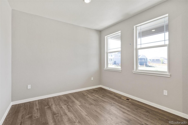 14249 Beebalm Ave, Parker, CO 80134 - unfurnished room with dark wood-style floors and baseboards