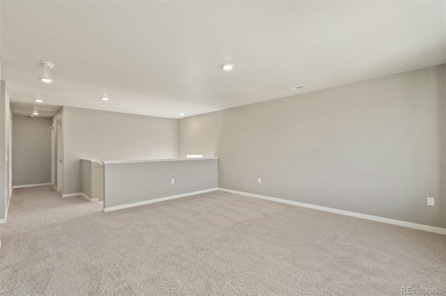14249 Beebalm Ave, Parker, CO 80134 - empty room featuring light colored carpet, recessed lighting, and baseboards