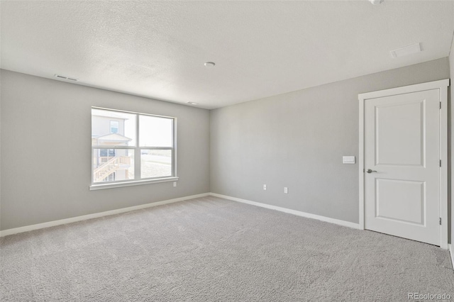 14249 Beebalm Ave, Parker, CO 80134 - unfurnished room featuring carpet floors, baseboards, and a textured ceiling