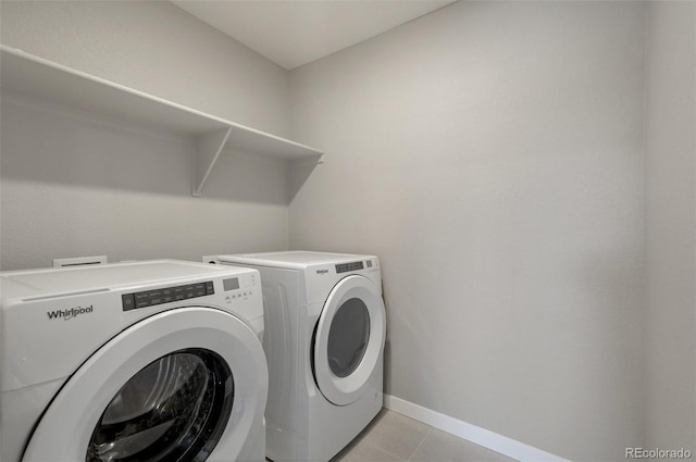 14249 Beebalm Ave, Parker, CO 80134 - washroom featuring independent washer and dryer, light tile patterned flooring, and baseboards